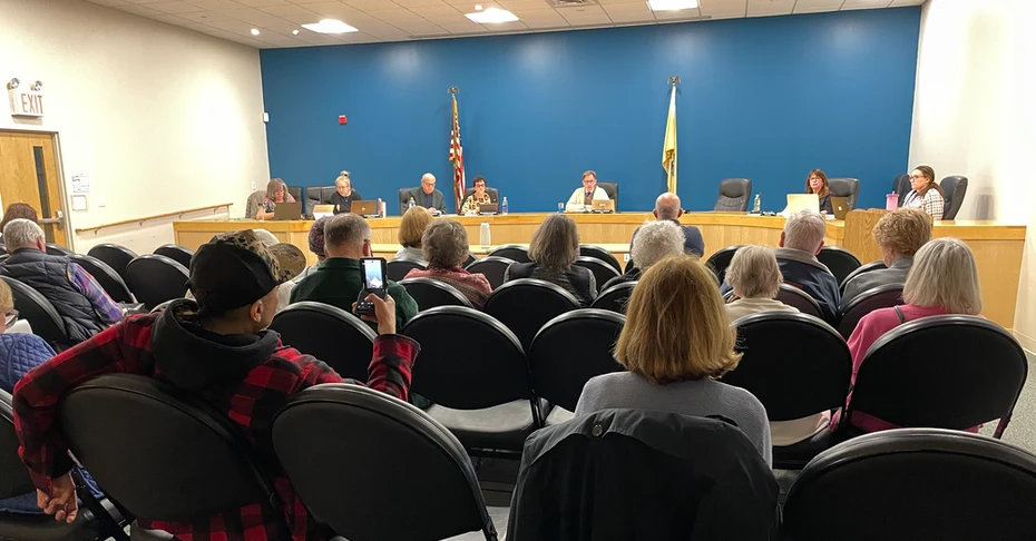 city council sitting before an engaged group of residents