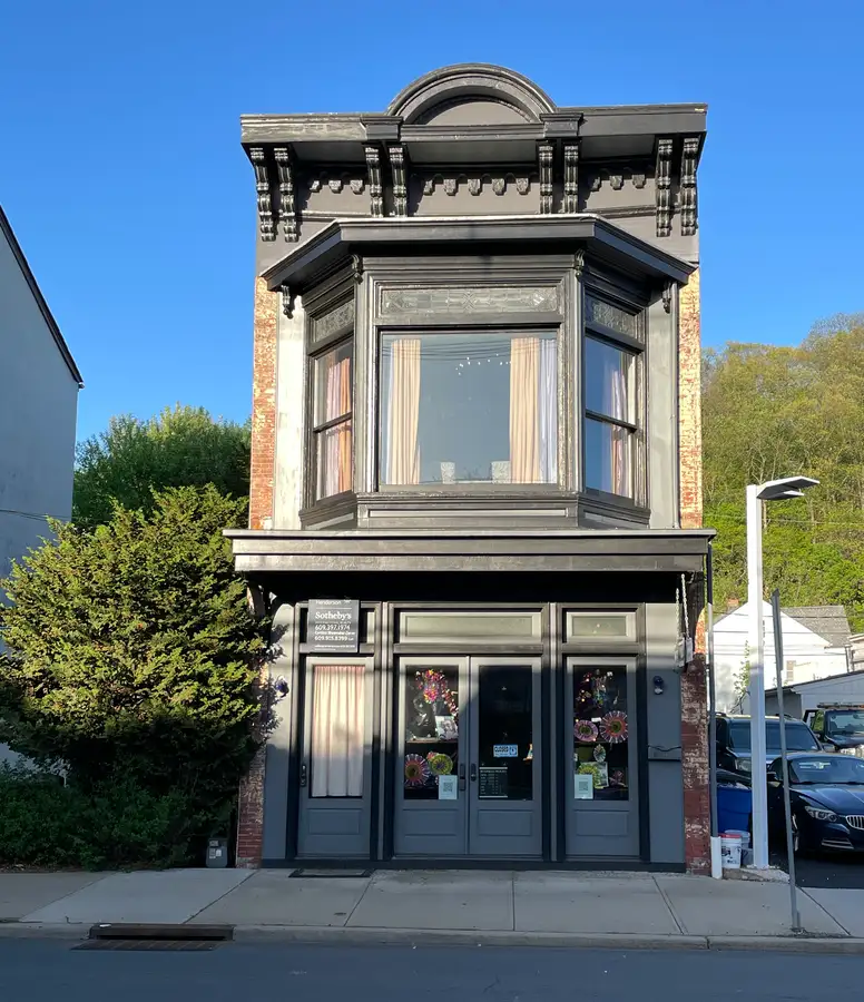 an old firehouse building with a record store on the first floor