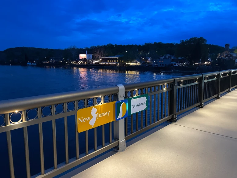 the NJ/PA state line as designated via a small sign on the walkway of the bridge