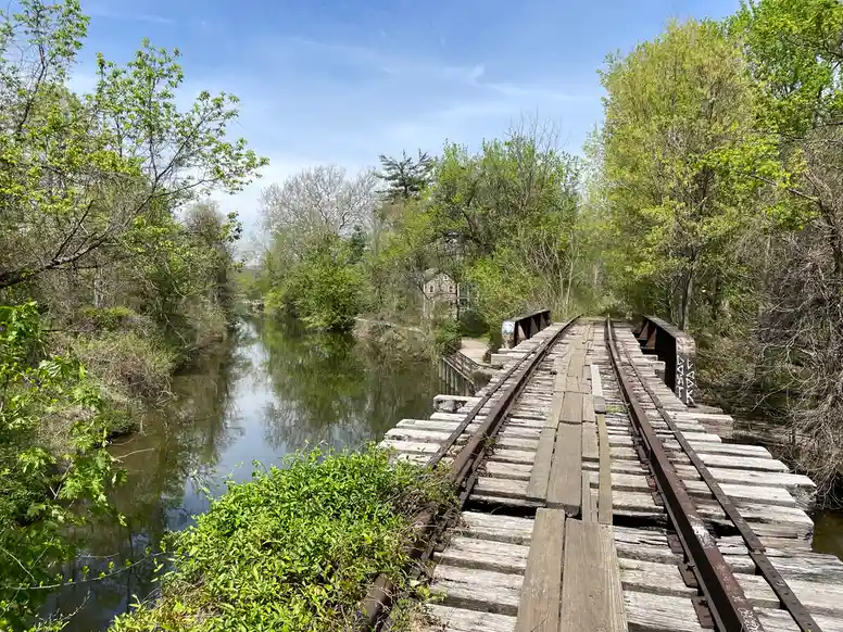 standing atop of an old train bridge with the canal on the left