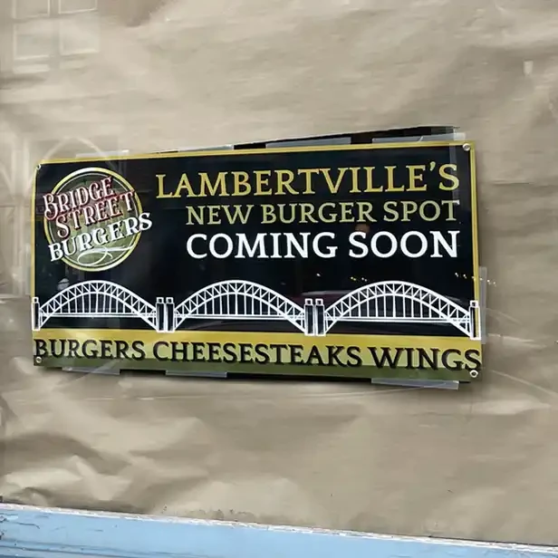 coming soon sign in the window