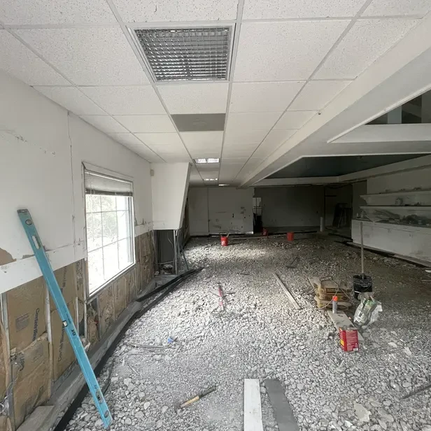 interior of a retail space with the concrete floor all broken up