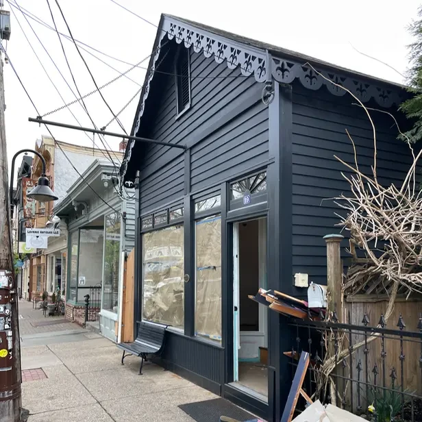 the black facade of a small shop