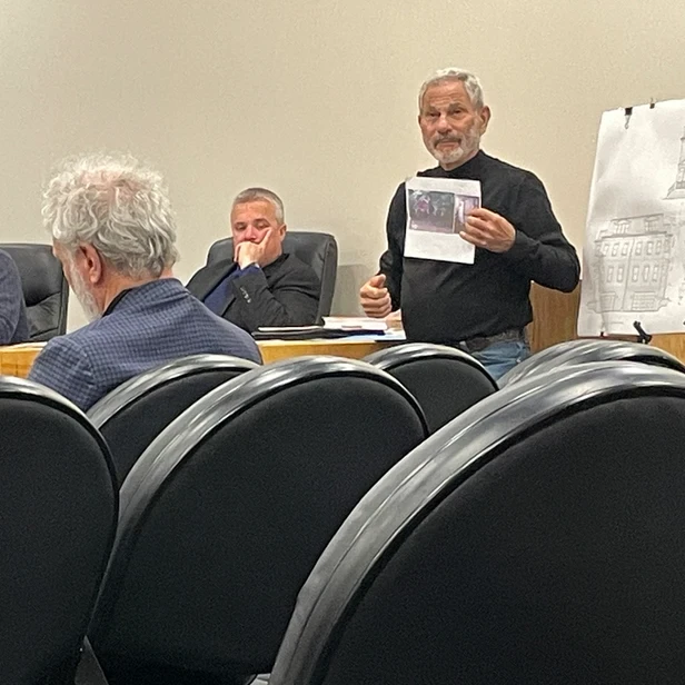Don showing an image to the board