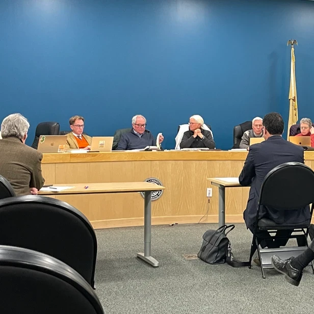 board members and representatives in a meeting