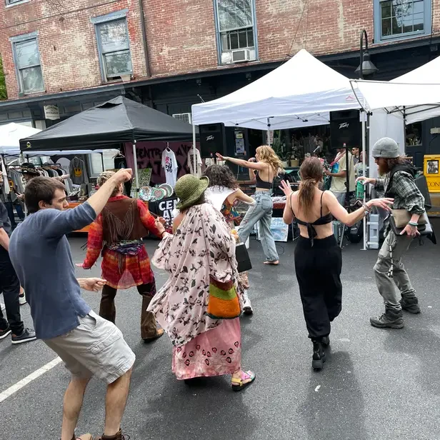 young people dancing in the street