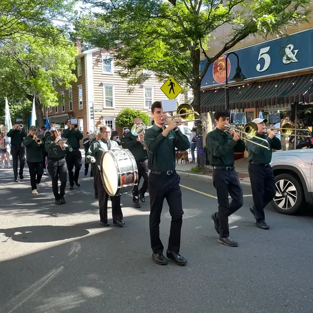 a marching band going down union street