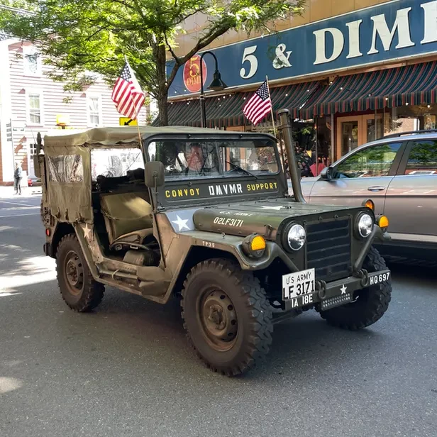 military jeep with american flags on it