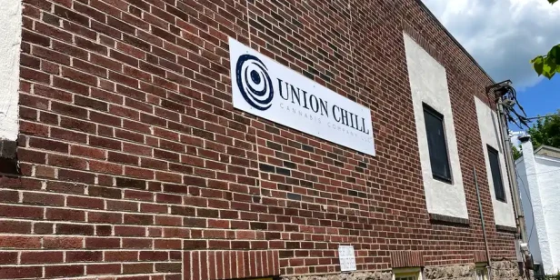 a brick building with a sign on it that reads "Union Chill"