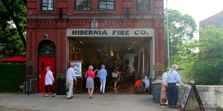 people entering the Hibernia Firehouse to see an art show