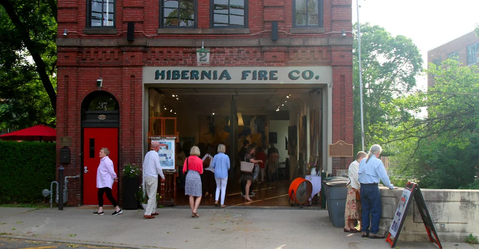 people entering the Hibernia Firehouse to see an art show