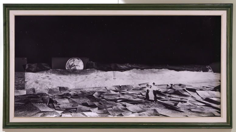 surface of the moon with three Black homesteaders standing amongst large paper plots with Earthrise in background