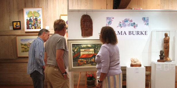 Phillips’ Mill patrons with chair of the Selma Burke show, Mary Flamer