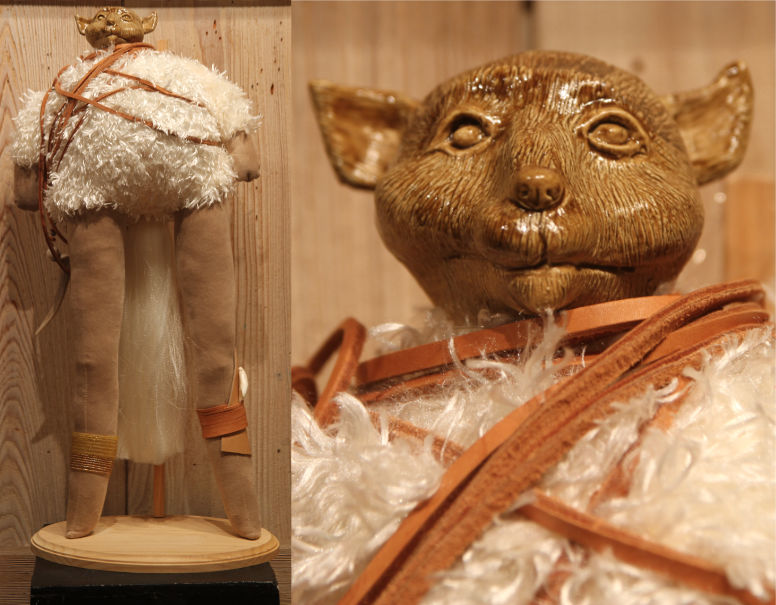 whimsical doll with long legs, furry body, and ceramic creature head