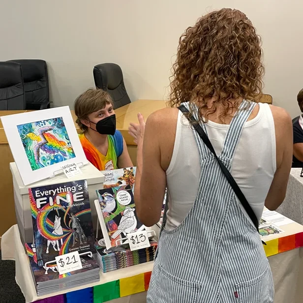 Gwenn talking with a customer