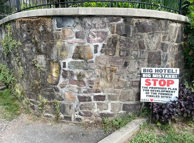 an anti Coryell Hotel sign along the canal path