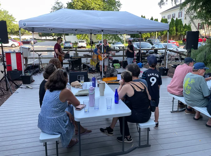 a rock band playing on a patio outside