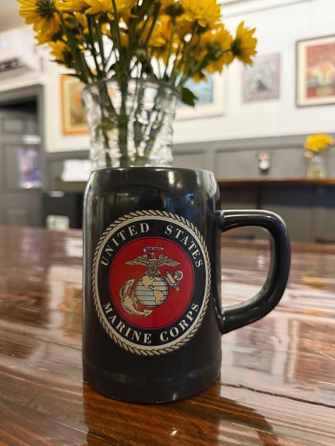 a mug with a marine logo printed on it
