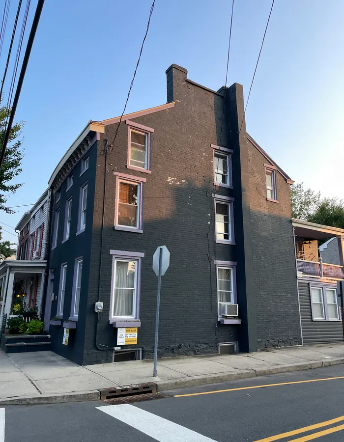 a dark purple house with light purple trim