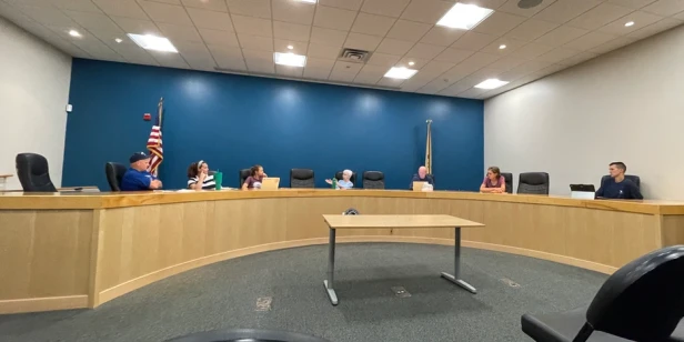 seven people sitting sitting and discussing parks and recreation issues