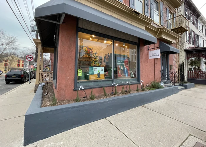 a store with art in the window