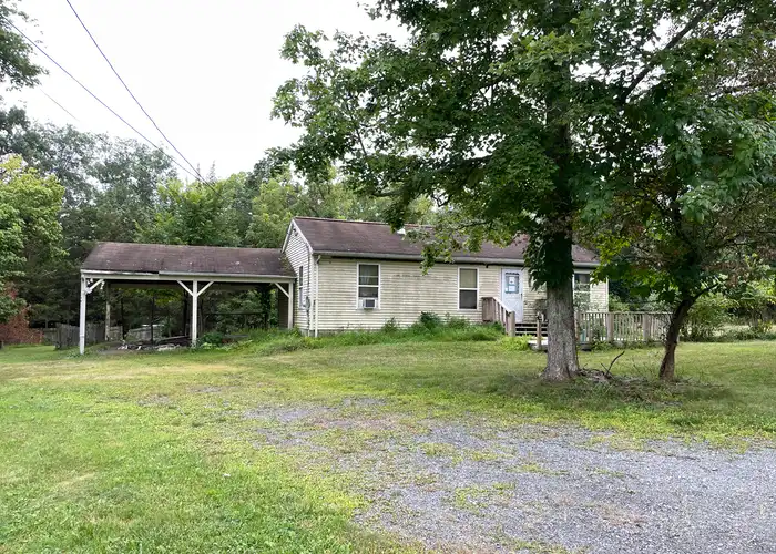 an old house on a ragged lot