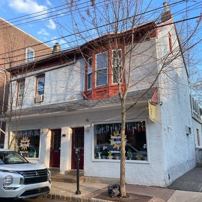 a two-story building with a restarant on the first floor