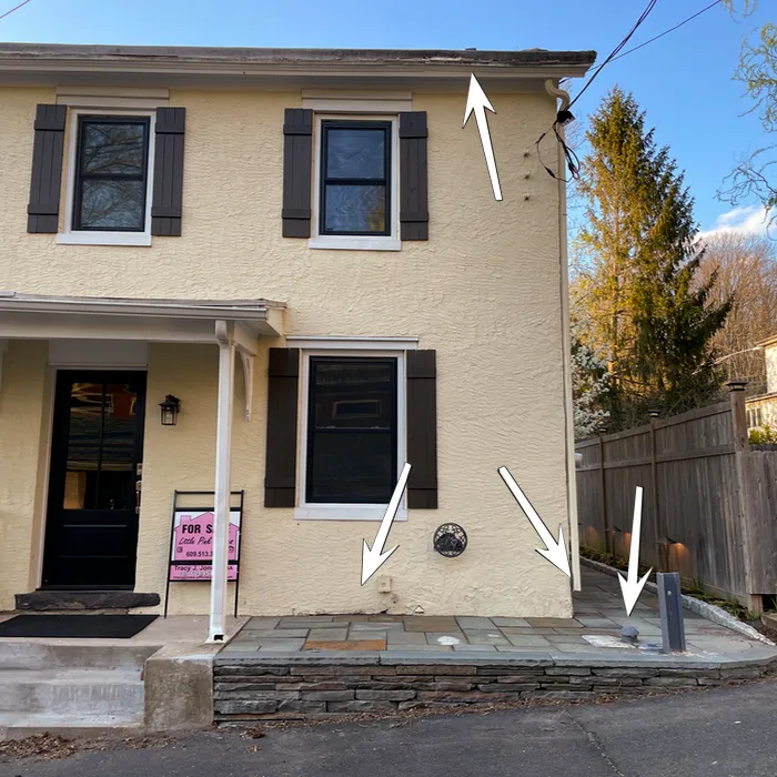 a small house with new windows and a new front door