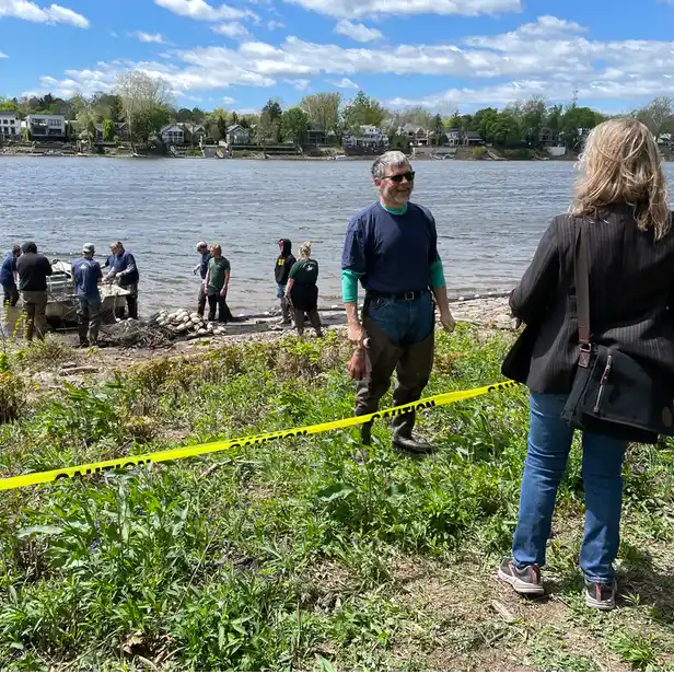 people preparing a net by the river